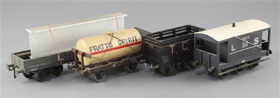 An LMS wagon 30T with girder load, no.7960, in grey, a TCD Ltd cattle truck, no.171, in black, a Pratts tanker,